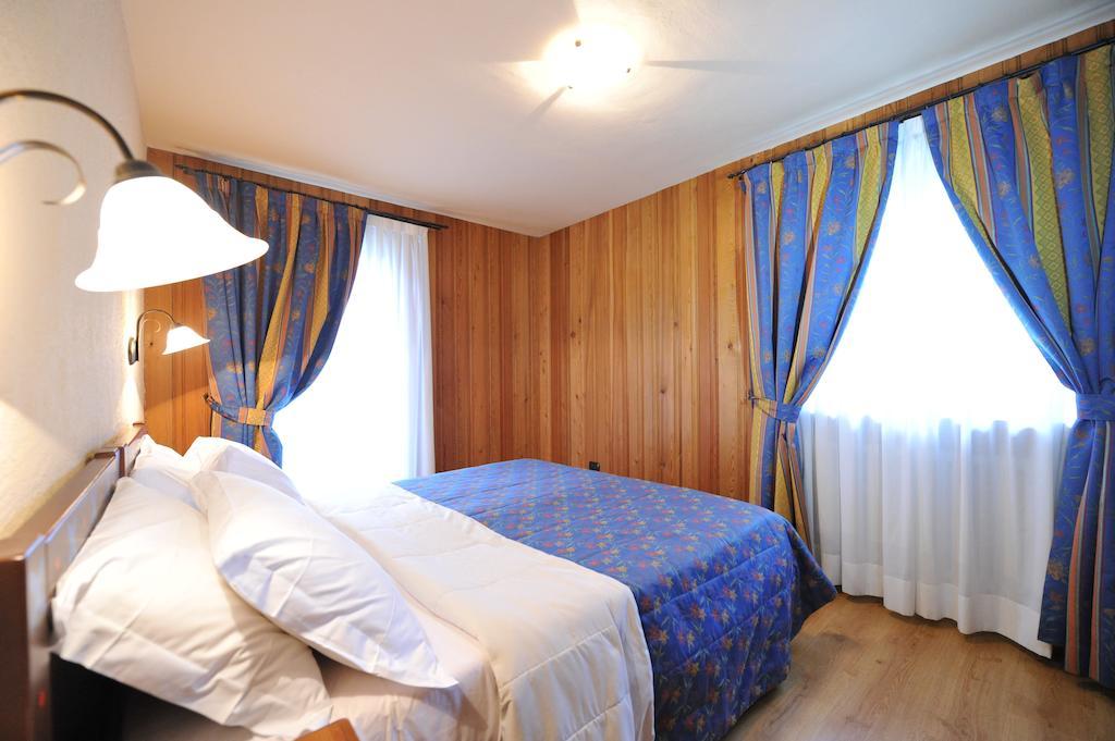 Family Apartments Le Chalet ชัมโปลุก ห้อง รูปภาพ
